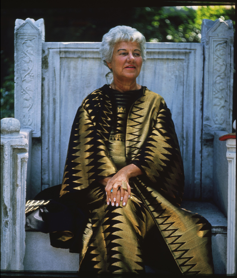 Peggy Guggenheim sitting on the throne in the garden of Palazzo Venier dei Leoni, Venice, 1960s. Photo Roloff Beny / courtesy of Archives and National Archives of Canada